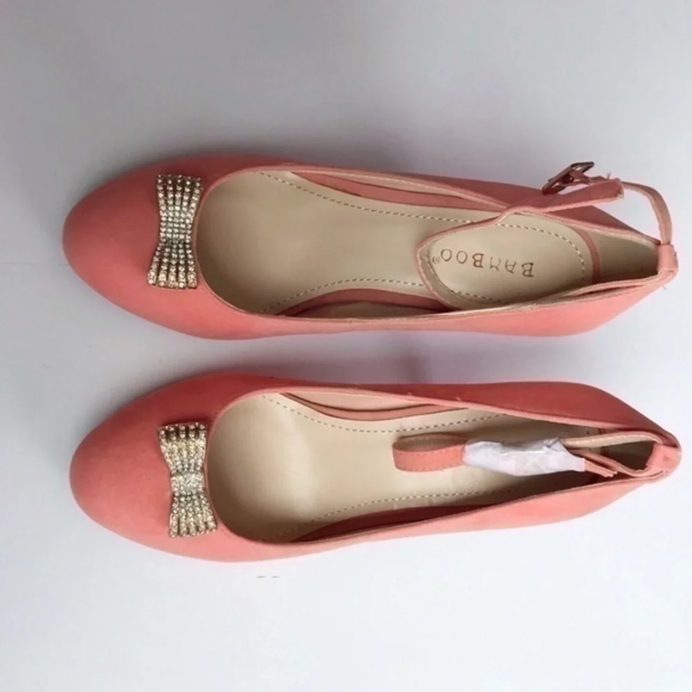 Pink faux suede bamboo heels with bow
